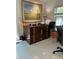 Bright office featuring a flat file cabinet with a large painting, a desk, and natural light from the window at 728 41St St St, Sarasota, FL 34234
