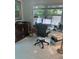 Bright home office features a large map cabinet, desk and chair with an outdoor view at 728 41St St St, Sarasota, FL 34234