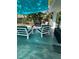 A relaxing outdoor patio with stylish furniture, a water feature, and ample shade for comfortable lounging at 728 41St St St, Sarasota, FL 34234