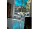 View to backyard patio from interior living space through sliding glass doors at 728 41St St St, Sarasota, FL 34234