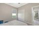 Comfortable bedroom featuring a ceiling fan, window, double door closet, and ensuite bathroom at 7424 Ridgelake Cir, Bradenton, FL 34203
