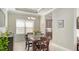 Dining room featuring a wooden table and chairs, complemented by bright natural light at 7424 Ridgelake Cir, Bradenton, FL 34203