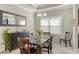 Formal dining room with decorative mirror, dark wood furniture, and an elegant chandelier at 7424 Ridgelake Cir, Bradenton, FL 34203