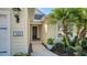 Inviting front entryway showcasing a well-lit porch and manicured landscaping at 7424 Ridgelake Cir, Bradenton, FL 34203