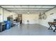 Spacious garage with epoxy floors, storage, and ample room for parking and projects at 7424 Ridgelake Cir, Bradenton, FL 34203