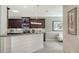 Kitchen boasts granite countertops, white backsplash, dark cabinets, and stainless steel appliances at 7424 Ridgelake Cir, Bradenton, FL 34203