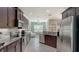 Well-lit kitchen showcases stainless steel appliances, granite countertops, and ample cabinet space at 7424 Ridgelake Cir, Bradenton, FL 34203