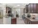 Bright kitchen featuring granite countertops, stainless steel appliances, and sleek dark cabinetry at 7424 Ridgelake Cir, Bradenton, FL 34203