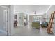 Open-concept living space featuring tile flooring, neutral paint, and a seamless flow into the kitchen at 7424 Ridgelake Cir, Bradenton, FL 34203
