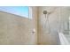 Beautifully tiled shower features glass enclosure, hand held shower head, and convenient soap dish at 7424 Ridgelake Cir, Bradenton, FL 34203
