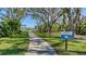 Scenic walking trail meandering through lush greenery, promoting an active and healthy lifestyle for residents at 7424 Ridgelake Cir, Bradenton, FL 34203