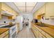 Well-lit kitchen featuring laminate counters, modern appliances, and an open view to the living space at 7460 Mariana Dr, Sarasota, FL 34231