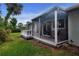 Back porch with outdoor furniture overlooking backyard at 800 Everest Rd, Venice, FL 34293