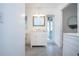 Bathroom featuring a white vanity cabinet, access to the exterior, and bedroom access at 800 Everest Rd, Venice, FL 34293