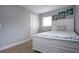 Comfortable bedroom with coastal decor and white wood frame bed at 800 Everest Rd, Venice, FL 34293