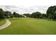 Lush green golf course fairway with a winding cart path at 800 Everest Rd, Venice, FL 34293