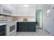 Well-equipped kitchen with modern appliances, white cabinets, and neutral countertops for a clean look at 800 Everest Rd, Venice, FL 34293