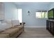 Comfortable living room with a sofa, television, and view of outside at 800 Everest Rd, Venice, FL 34293