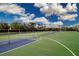 Well-maintained tennis and pickleball court with nets and recreational space at 800 Everest Rd, Venice, FL 34293