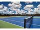 Enjoy a match on these meticulously maintained blue and green tennis courts, surrounded by nature at 800 Everest Rd, Venice, FL 34293