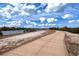 Enjoy a peaceful outdoor path with waterfront views and scenic surroundings at 800 Everest Rd, Venice, FL 34293
