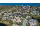 Picturesque aerial view of a residential neighborhood with a waterfront backdrop, highlighting community charm at 8861 17Th Avenue Nw Cir, Bradenton, FL 34209
