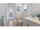 Bright bathroom featuring a single vanity and access to the pool, offers convenience and style at 8861 17Th Avenue Nw Cir, Bradenton, FL 34209