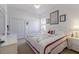 Comfortable bedroom with a ceiling fan, white furniture, and a queen-sized bed at 8861 17Th Avenue Nw Cir, Bradenton, FL 34209
