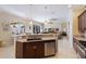 Open-concept kitchen includes a granite countertop, stainless steel appliances, and a seamless flow to living areas at 8861 17Th Avenue Nw Cir, Bradenton, FL 34209