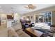 Inviting living area featuring seamless access to a well-appointed kitchen and a view of the outdoor pool area at 8861 17Th Avenue Nw Cir, Bradenton, FL 34209