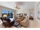 Bright living room provides access to the pool area through sliding glass doors, creating a relaxing atmosphere at 8861 17Th Avenue Nw Cir, Bradenton, FL 34209
