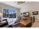 Comfortable living room with sliding glass doors leading to a pool view provides ample natural light at 8861 17Th Avenue Nw Cir, Bradenton, FL 34209