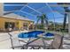 Enclosed pool with a spa, and outdoor dining, offering a relaxing oasis at 8861 17Th Avenue Nw Cir, Bradenton, FL 34209