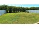 Spacious backyard featuring a well-manicured lawn and privacy fencing at 8996 Excelsior Loop, Venice, FL 34293