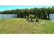 Lush backyard with privacy landscaping and a white vinyl fence at 8996 Excelsior Loop, Venice, FL 34293