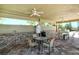 Community amenity with a covered seating area, tables, and fans at 8996 Excelsior Loop, Venice, FL 34293