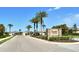 Welcoming entrance to Rapalo, an A.D. Horton community, featuring lush landscaping and palm trees at 8996 Excelsior Loop, Venice, FL 34293
