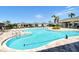 Resort-style community pool with ample seating and shaded cabana area at 8996 Excelsior Loop, Venice, FL 34293