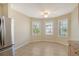 Bright dining nook featuring tile flooring, ample natural light, and a view of the surrounding landscape at 8996 Excelsior Loop, Venice, FL 34293