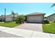 Charming single-Gathering home with a two-car garage and well-maintained landscaping at 8996 Excelsior Loop, Venice, FL 34293