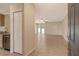 Spacious living room with tile flooring and a view of the backyard through sliding glass doors at 8996 Excelsior Loop, Venice, FL 34293