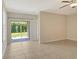 Bright living area with sliding glass doors that open to a private outdoor space at 8996 Excelsior Loop, Venice, FL 34293