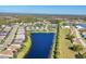 Panoramic aerial view of a lakeside community with well-manicured lawns and scenic surroundings at 1014 Calico Gln, Bradenton, FL 34212