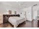 Relaxing bedroom with hardwood floors and a ceiling fan at 1014 Calico Gln, Bradenton, FL 34212