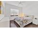 Bedroom with hardwood floors, a ceiling fan, and large window at 1014 Calico Gln, Bradenton, FL 34212