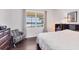 Relaxing bedroom with hardwood floors and a beautiful water view at 1014 Calico Gln, Bradenton, FL 34212