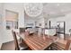Open-concept dining area with a view of the kitchen and living area, perfect for entertaining at 1014 Calico Gln, Bradenton, FL 34212