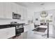 Bright, modern kitchen features stainless steel appliances, granite countertops, and ample cabinet space at 1014 Calico Gln, Bradenton, FL 34212