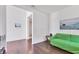 Bright living room offers a comfy sofa and hardwood floors at 1014 Calico Gln, Bradenton, FL 34212