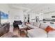 Open-concept living room and kitchen with hardwood floors and modern appliances, perfect for entertaining at 1014 Calico Gln, Bradenton, FL 34212